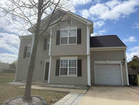 Exterior painting Wendell NC home exterior with restored black window shutters and completed screen installation in Goodwin Chase 27591.