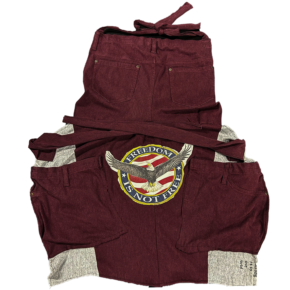 Upcycled apron with 'Freedom Isn’t Free' message, featuring durable fabric and adjustable neck strap for comfort