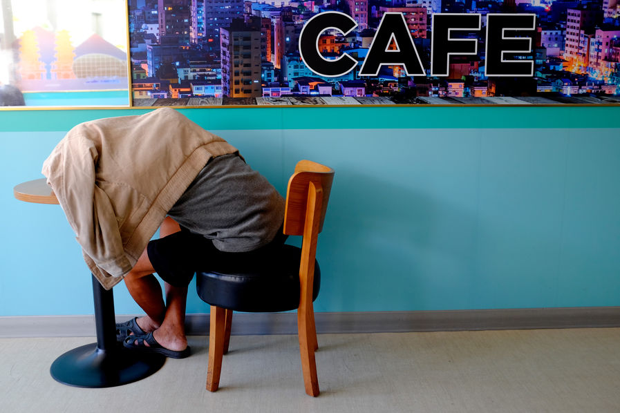 Performance art intervention against Pier-2 Art Centre's industrial backdrop, embodying Taiwan's postcolonial consciousness and its reclamation of space through artistic expression, informed by post-structuralist theory and critical spatial practices.