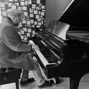 Musician/composer, Cory Zilisch, playing on a Steinway.
