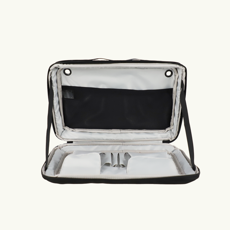 Open black Van Essential carrying case with compartments