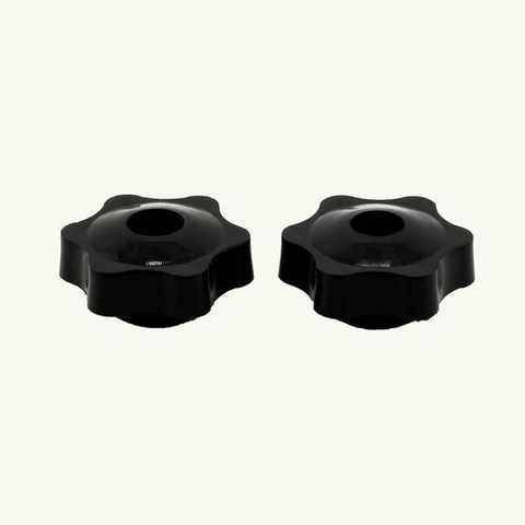 Two black plastic knobs for adjusting furniture