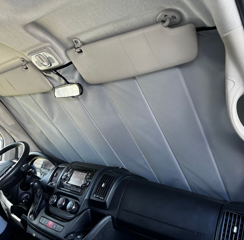 Grey van sunshade installed, blocking sunlight