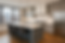 Midtown Manhattan kitchen renovation with quartz island, shaker cabinets, and city skyline
