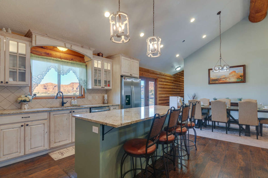 Log home in Southern Utah with antique-white kitchen cabinets
