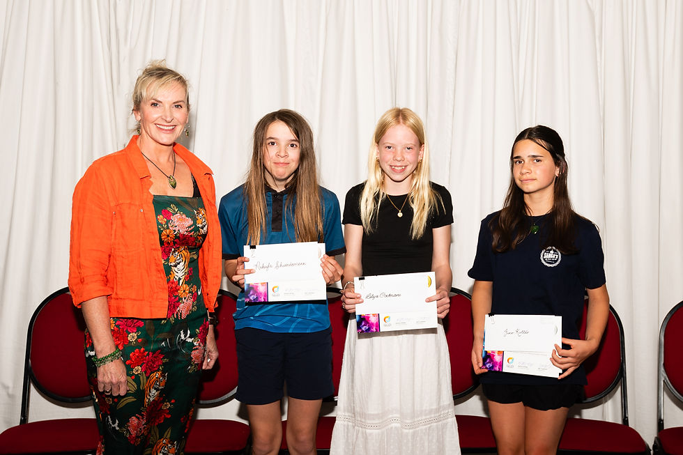 Dee Copeland with the three prize winners. From left to right: Makayla Schwendemann (third), Lilya Cochrane (first), and Juno Kōllar (second and people's choice)