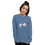 Thumbnail: woman wearing an indigo colored long sleeve tee with image of a flower, a bee, and a dog with a bump from a sting on nose