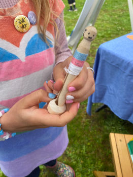 Girl making a worry doll craft