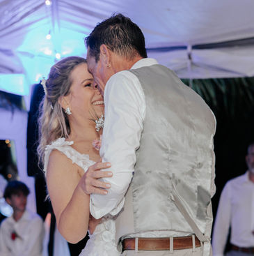Bride and groom slow dancing together at their wedding reception in Barbados.