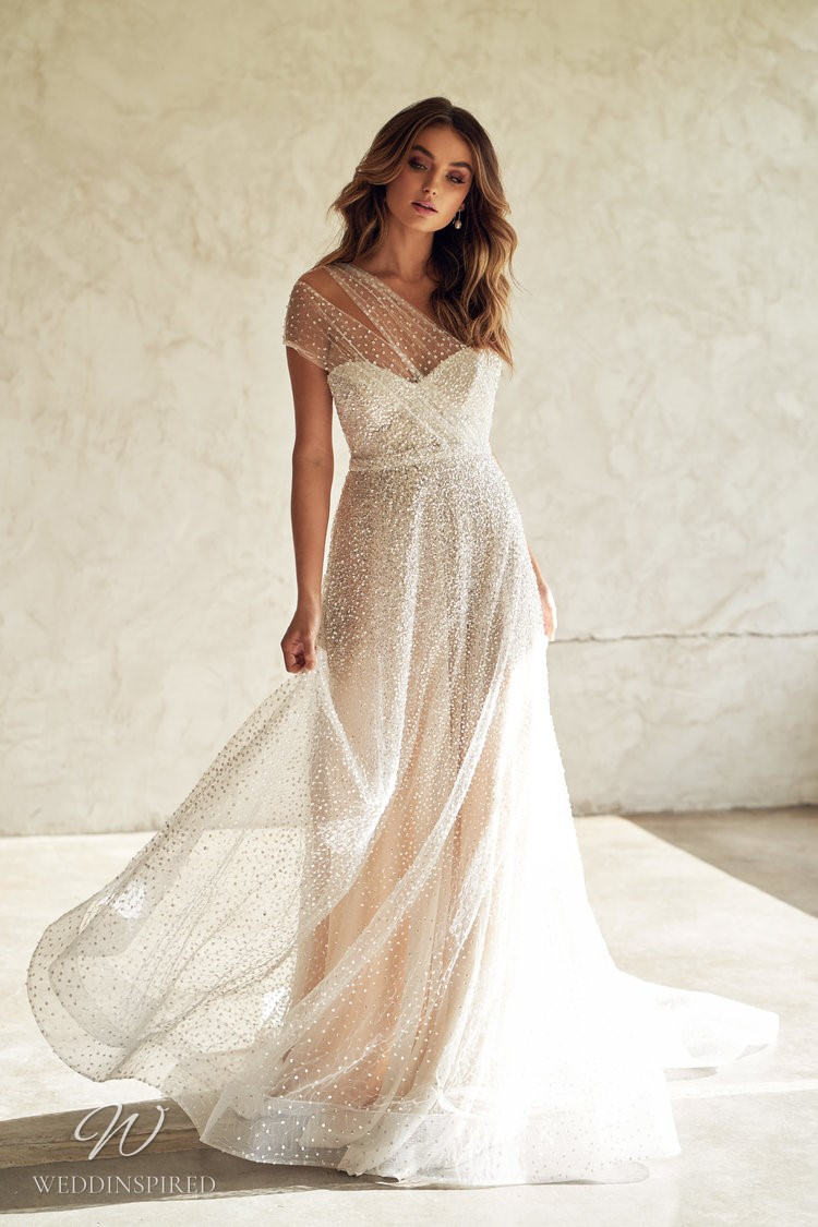 An Anna Campbell 2020 one shoulder blush A-line wedding dress with tulle and beading
