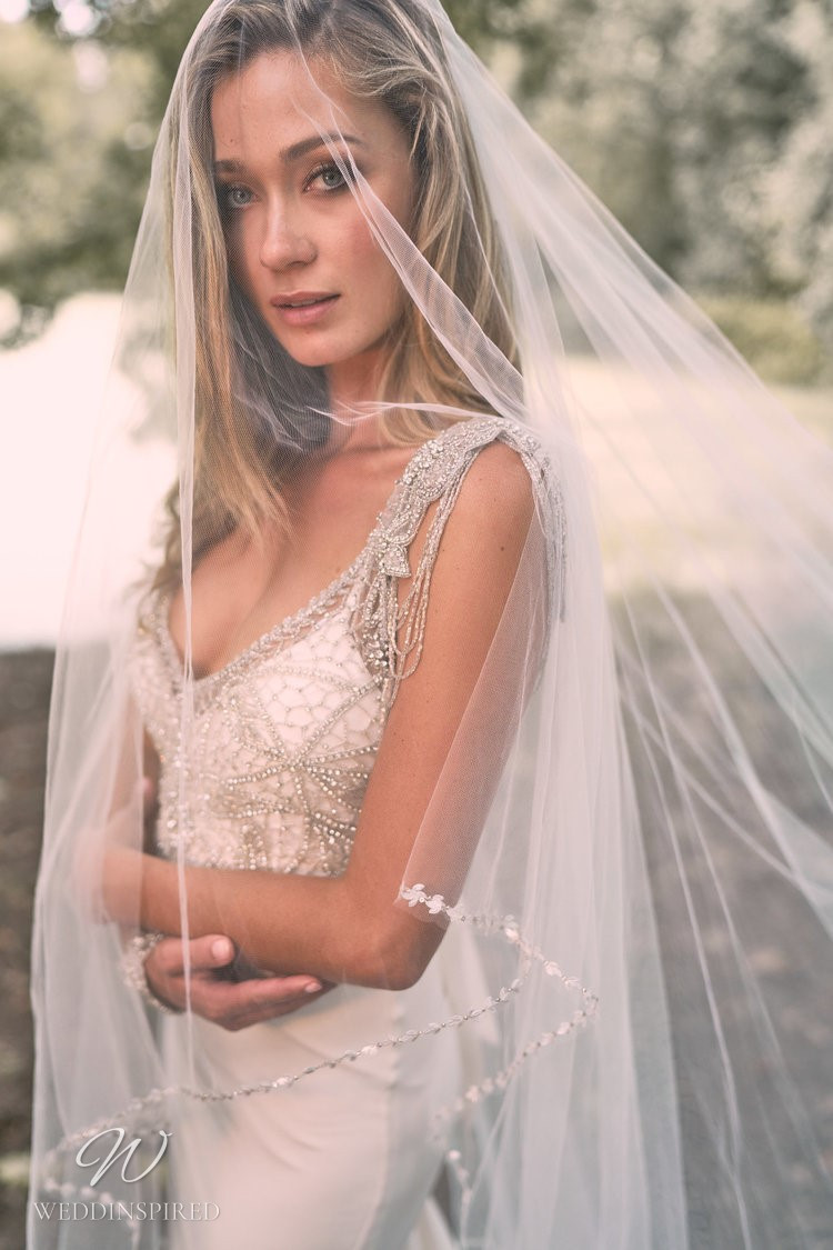 An Anna Campbell 2020 fitted v neck wedding dress with beading and crystal straps and bodice