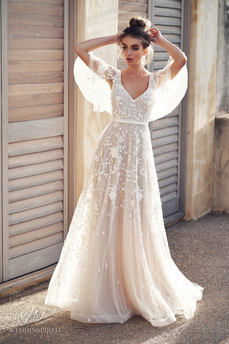 An Anna Campbell 2020 blush tulle and lace A-line wedding dress with draped sleeves