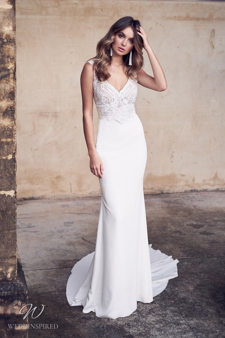 An Anna Campbell 2020 fitted crepe wedding dress with lace and a long train