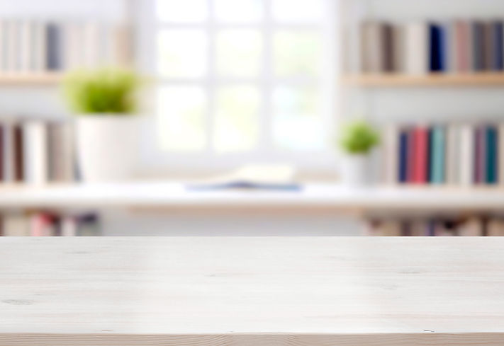 Close-up of a well-detailed white table and copy area in a hazy study space.jpg