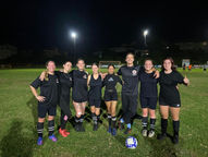 Football Ladies posing for team photo.