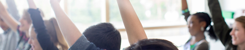 Teenage Students Raising Hands