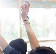 Teenage Students Raising Hands