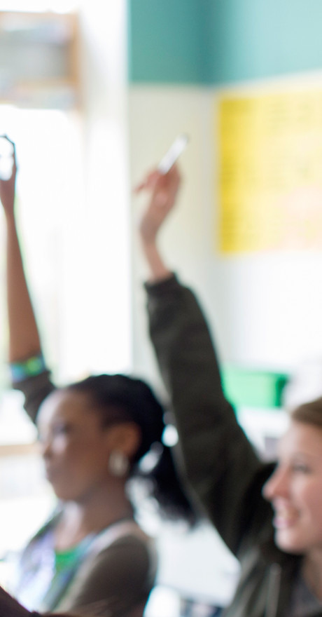 Teenage Students Raising Hands
