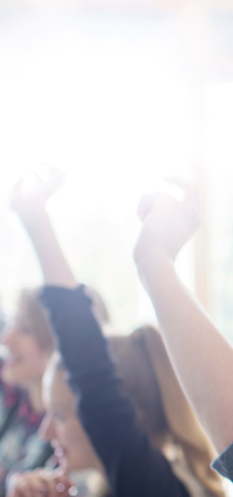 Teenage Students Raising Hands