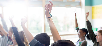 Teenage Students Raising Hands