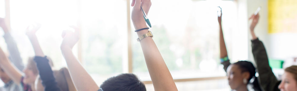 Teenage Students Raising Hands