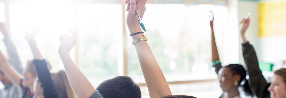 Teenage Students Raising Hands