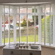 faux wood Venetian blinds in a bay window