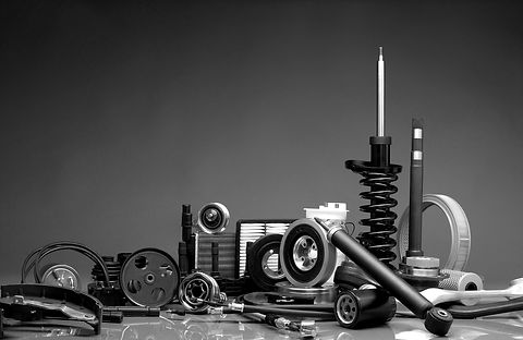 New car parts on a grey background