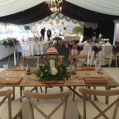 Wedding marquee wth rustic seating