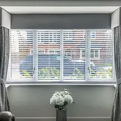faux wood Venetian blind in a picture window