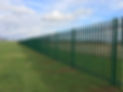 A green metal fence