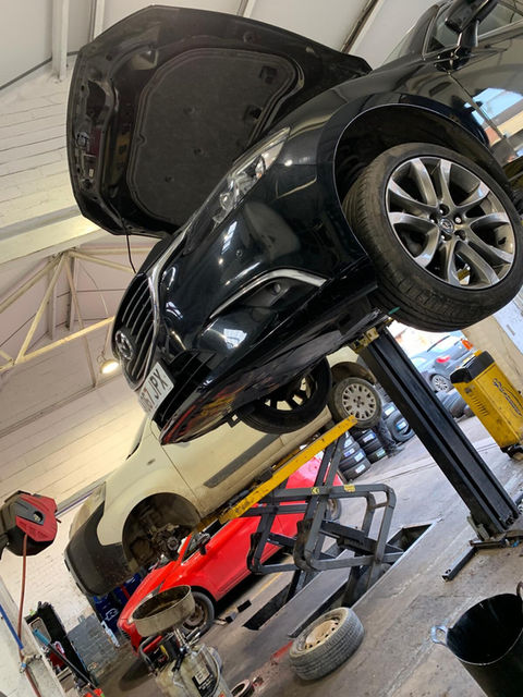 Black car at the lift ramp