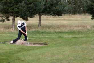 Golfer in a sand pit