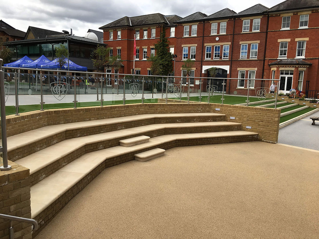 Landscaping project outside a large red brick building