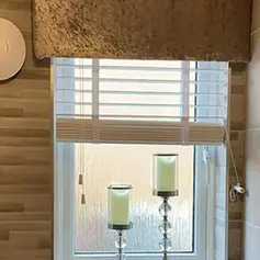 faux wood Venetian blinds partly drawn up