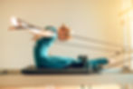 Fit woman instructor in yoga class promoting healthy lifestyle and physical activity.jpg