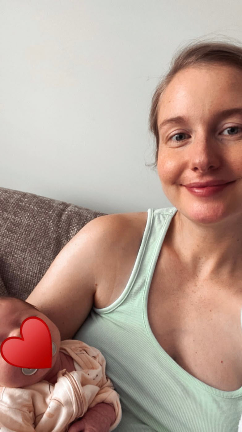 Northwich mum cuddling her newborn baby after attending pregnancy yoga with Yoga with Maryline