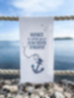 Thumbnail: Far-Far-Away-Home Anchor tea towel front view in white and navy
