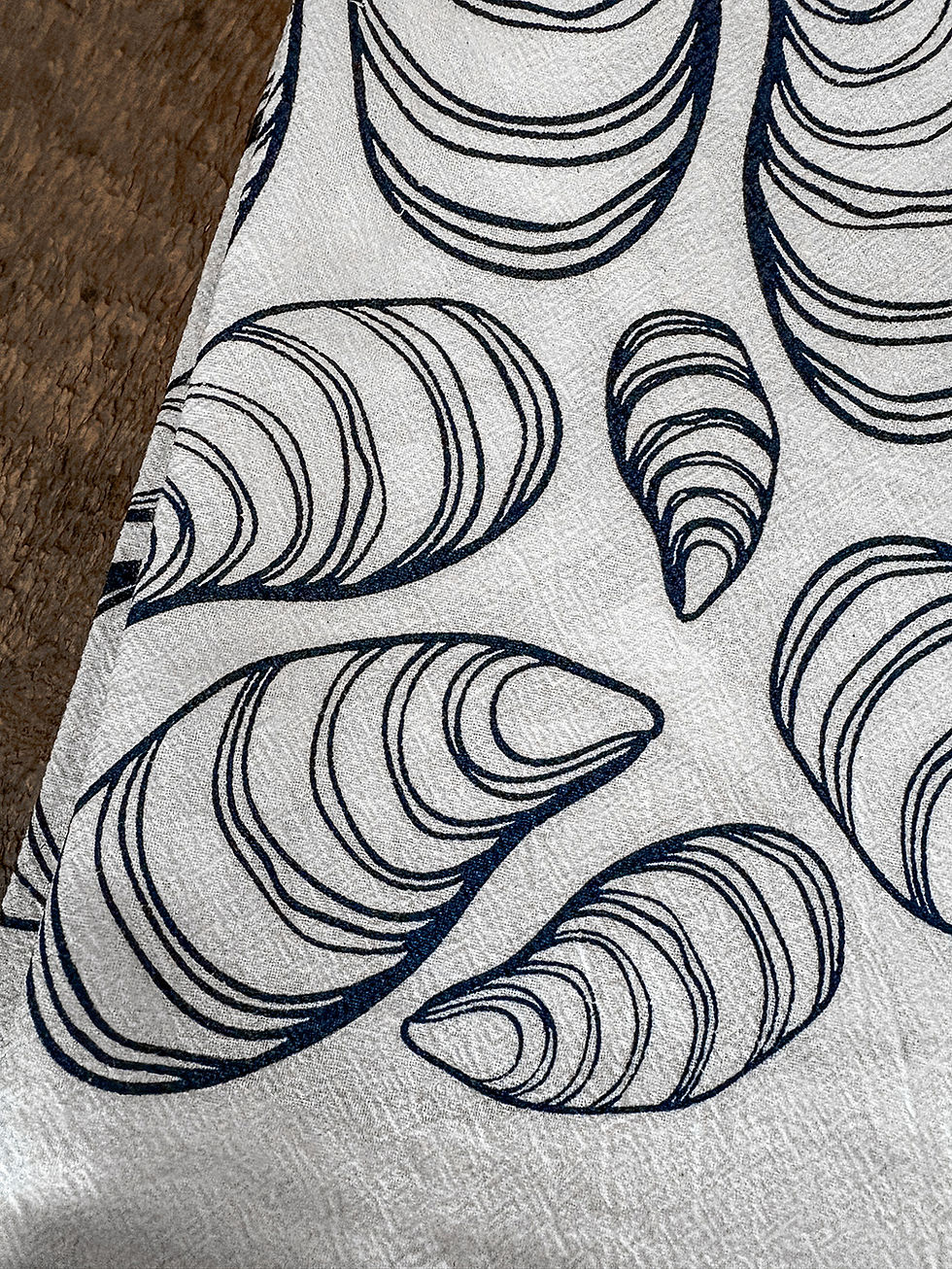 Thumbnail: far far away shop mussel tea towel printed in navy in on white cotton detail view
