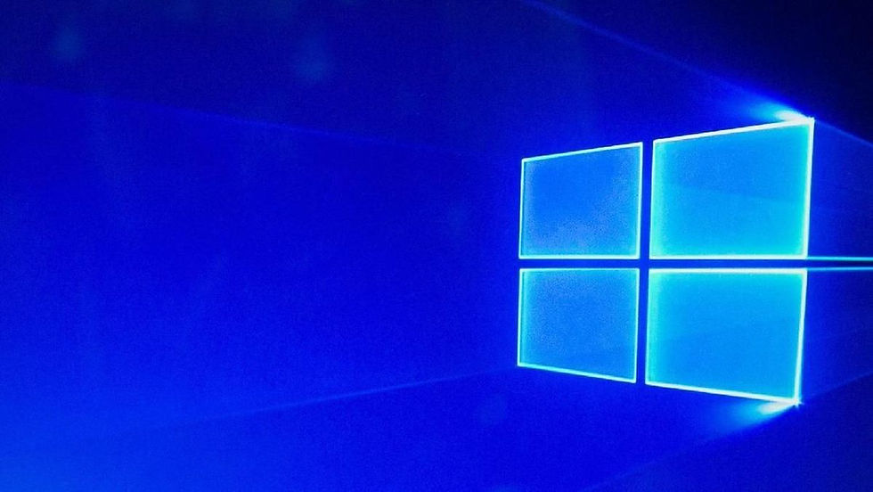 Gambar: Logo Windows 10 berwarna biru menyala dengan latar belakang gradasi biru.