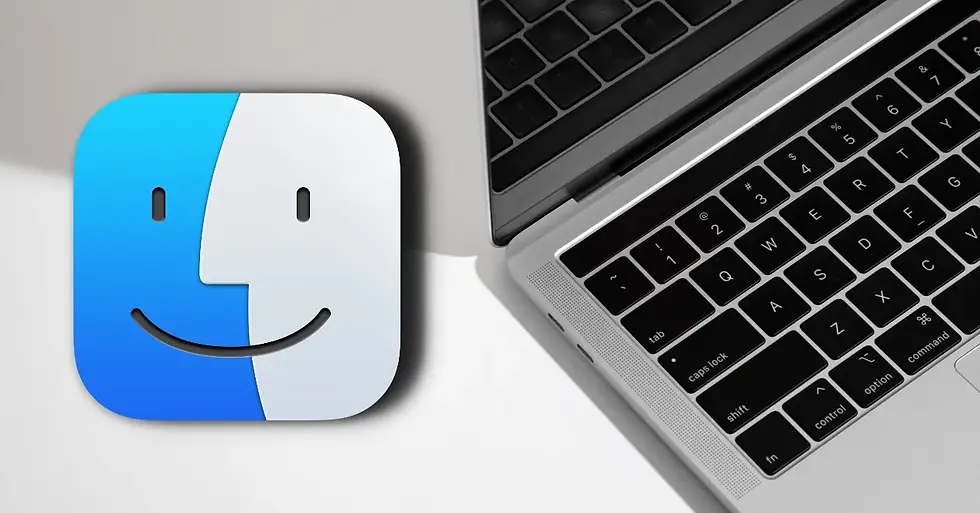 Gambar: Ikon Finder MacOS di samping laptop MacBook dengan keyboard hitam.