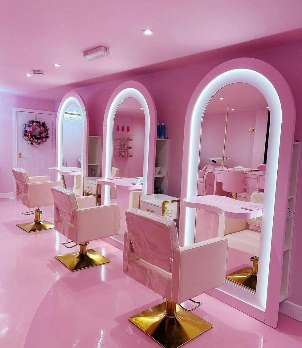 Modern pink beauty salon with stations for hair and lash extensions