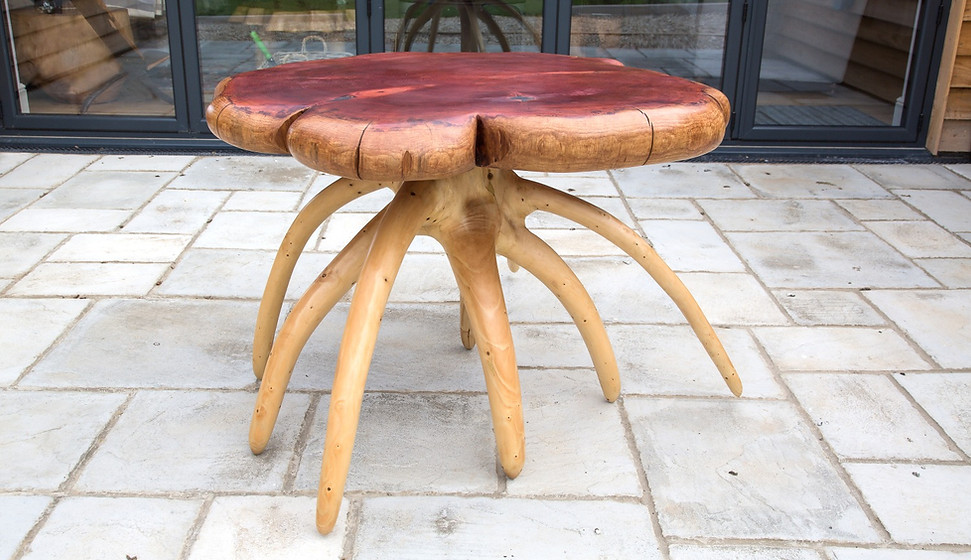 A handmade table made from natural wood with wany edges.