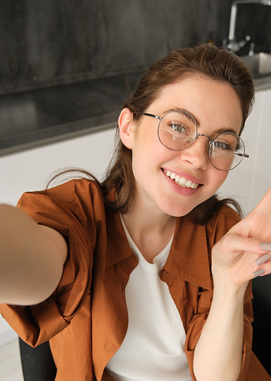 selfie-cute-young-woman-glasses-posing-home-kitchen-taking-pictures-her-mobile-phone.jpg