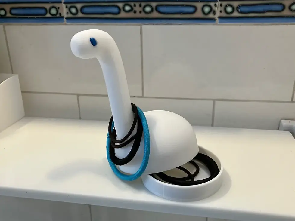Hair Tie Brontosaurus Organiser — primary product photo, 3D-printed personal care item by Tactform Ventures