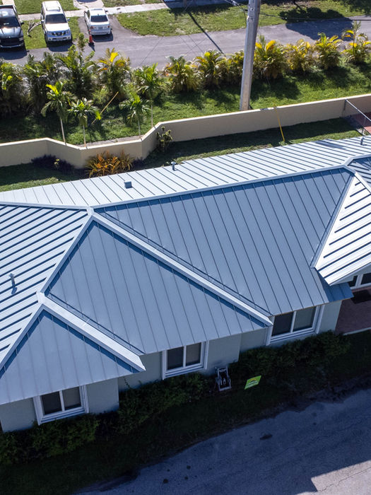 standing seam metal roof replacement for a residential home in Miami-Dade County by Greener Roofing & Solar.