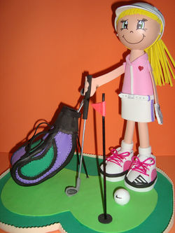 Muñeca golfista con bolsa.