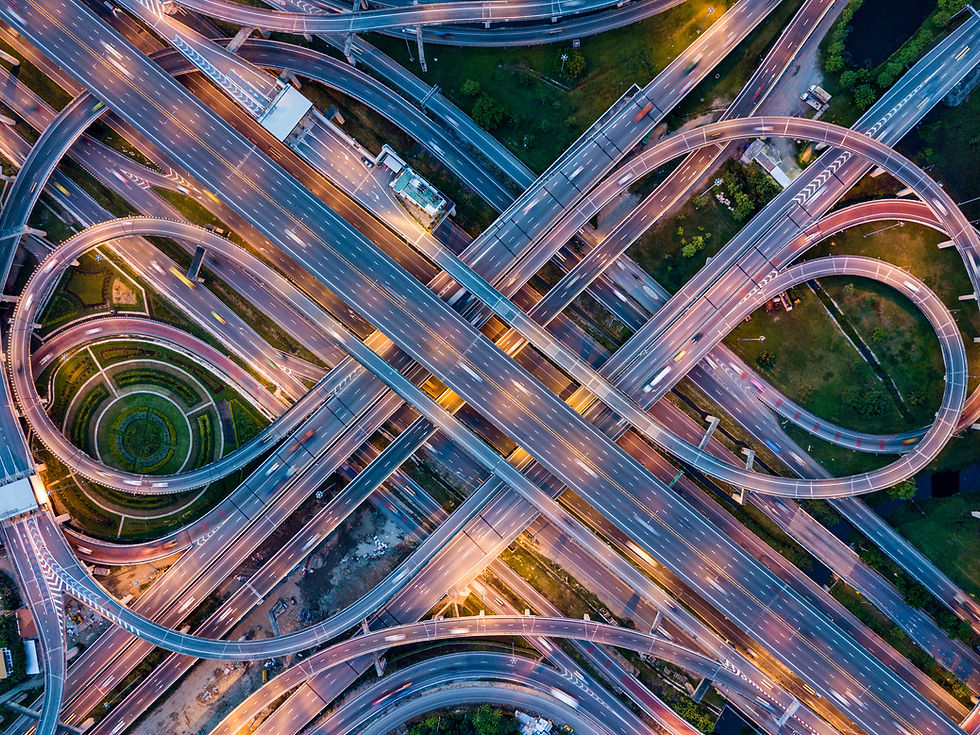 Aerial view of complex highway interchange symbolizing large-scale infrastructure projects, transportation planning, and gove