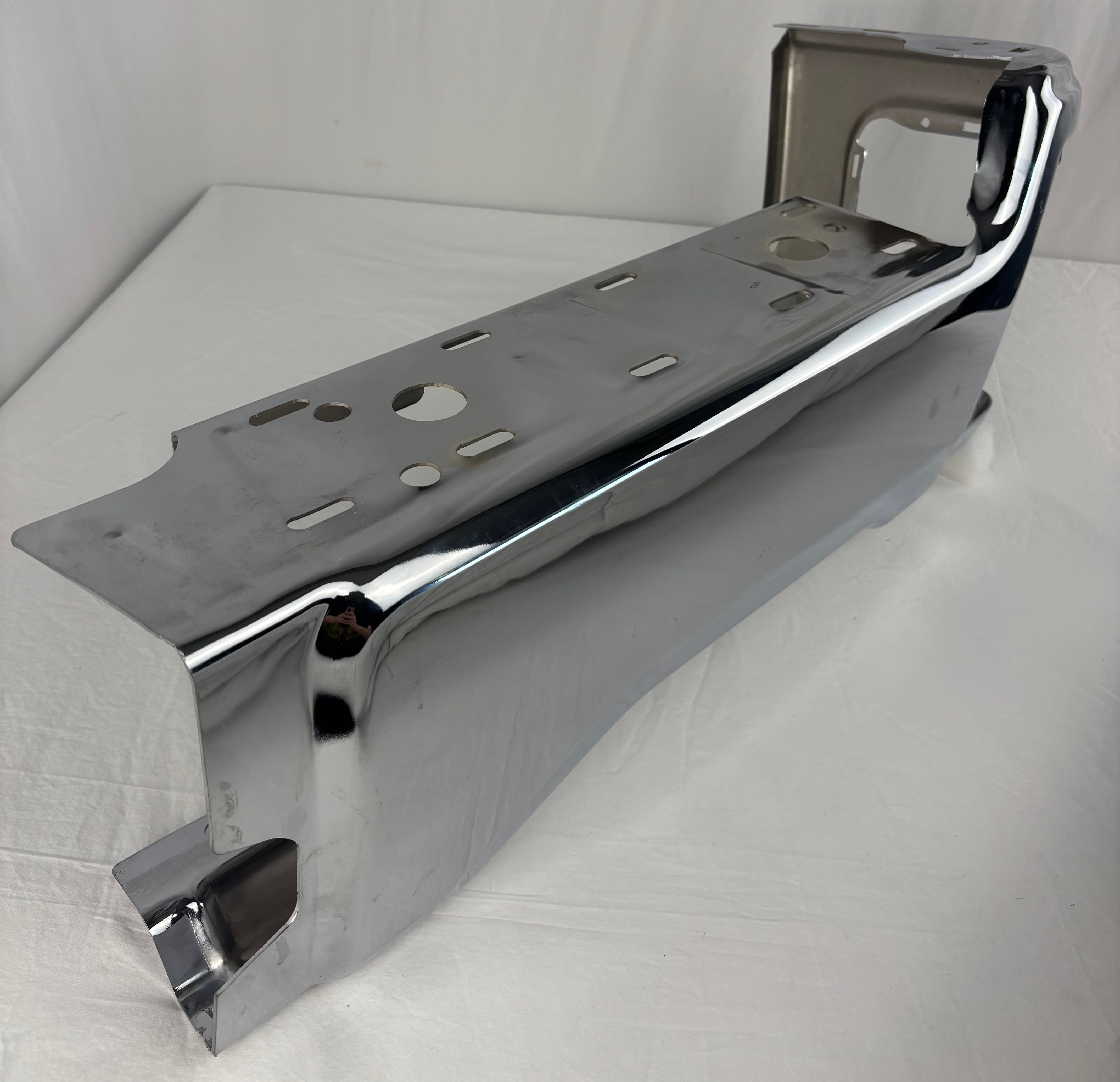 Chrome right rear bumper corner for 2023-2025 Ford Super Duty. Stamped steel replacement cap without parking sensor holes.