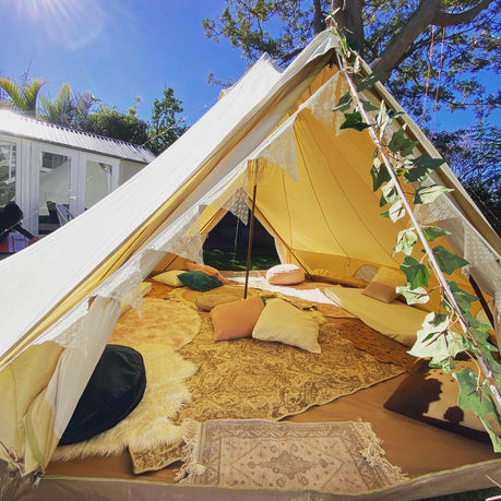 Bell tent glamping day party setup. Camping tent.